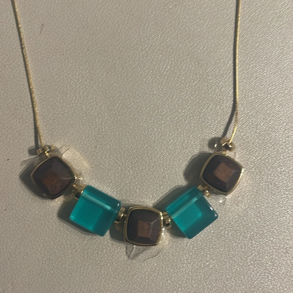Trina Turk gold plated necklace with turquoise beads and wooden accents
